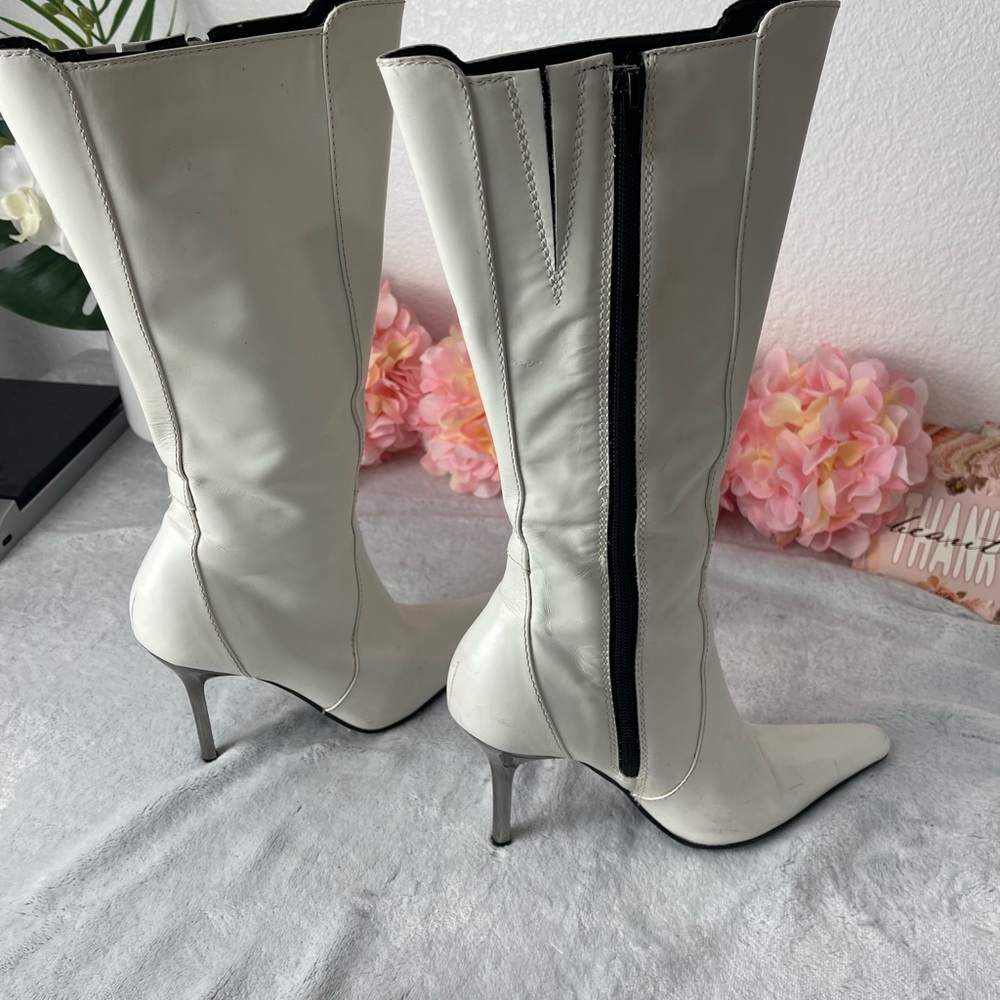 White,leather material with pointed toes and a knee-high length.Size 7